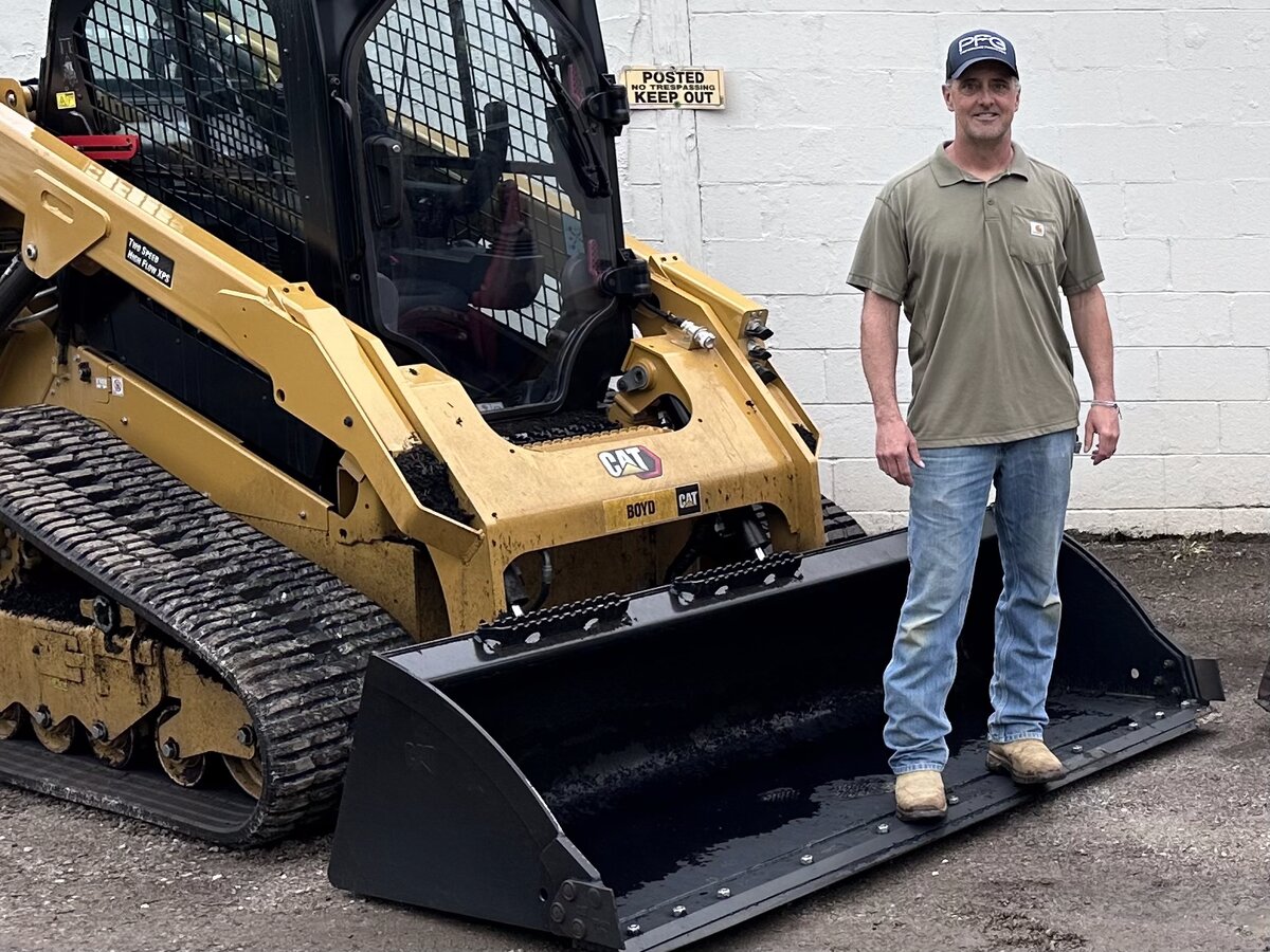Chris Milward with the Milward Septic CAT 255 skid steer